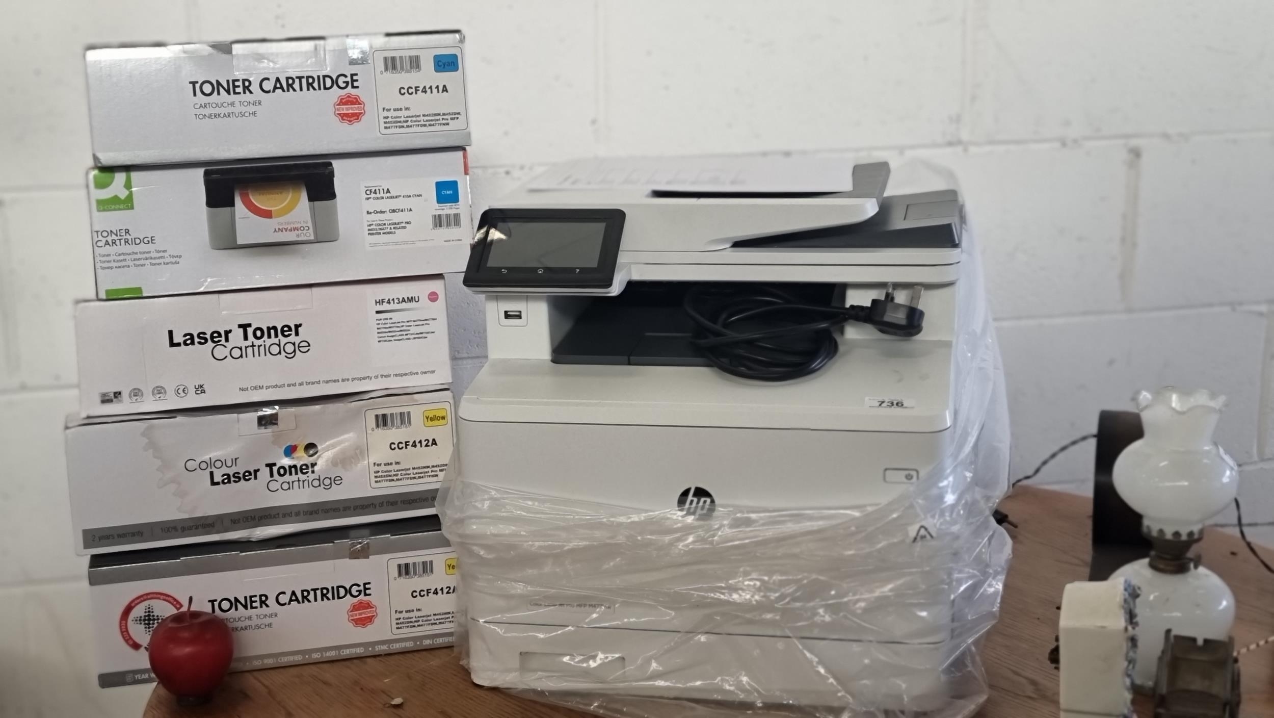 A HP Colour Laser Jet MFP M477fnw printer, scanner copier, with five