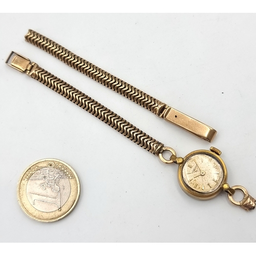 846 - A ladies vintage Longines Swiss made watch with a 9ct gold broken strap, Strap is hallmarked 375, st... 