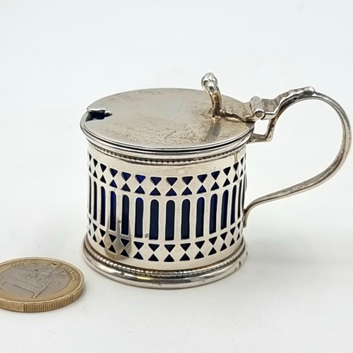 847 - A sterling Silver Mustard pot with a Bristol Blue glass liner. 68 grams, Assayed in London 1932