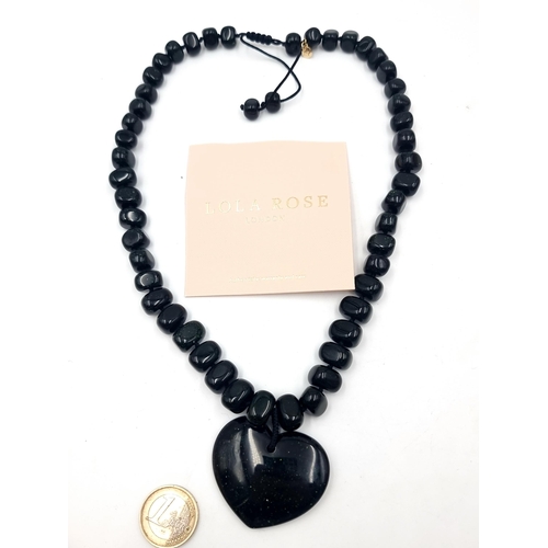 855 - A striking gemstone necklace by Lola Rose London consisting of black goldstone with green shimmering... 