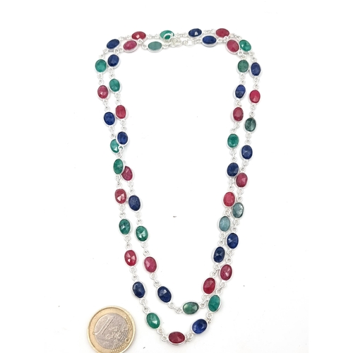 859 - Star lot : A simply stunning precious gemstone necklace, consisting of oval facet cut ruby's, emeral... 