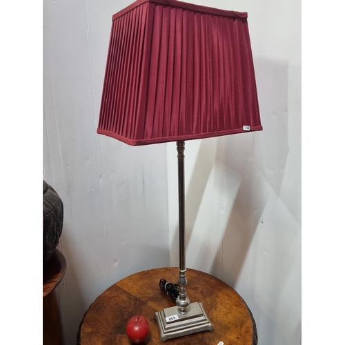 869 - A pretty tall  table lamp with a rectangular, cherry red shade with pleated detail, and a graduated ... 