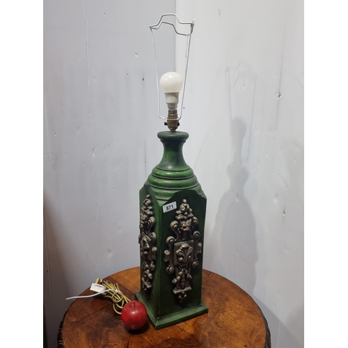 871 - An impressive very large green wooden lamp. Featuring gilded panels in high relief with both floral ... 