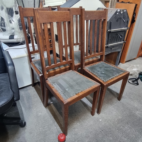 894 - A set of four vintage oak dining chairs. With railed back rest and original upholstery to the seats.... 