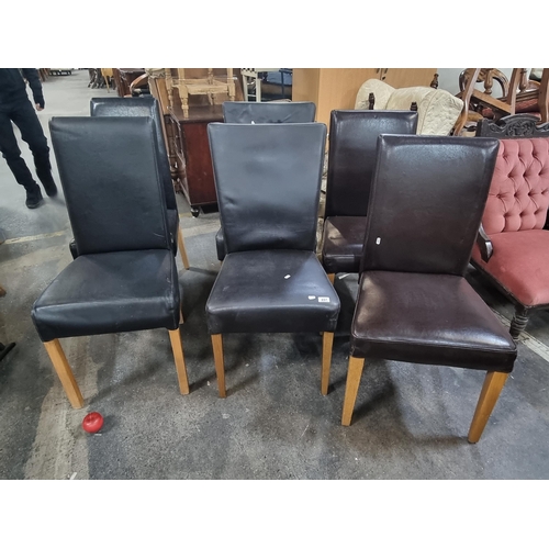 897 - A set of six high back genuine leather dining chairs. Including four black and two complimentary dar... 