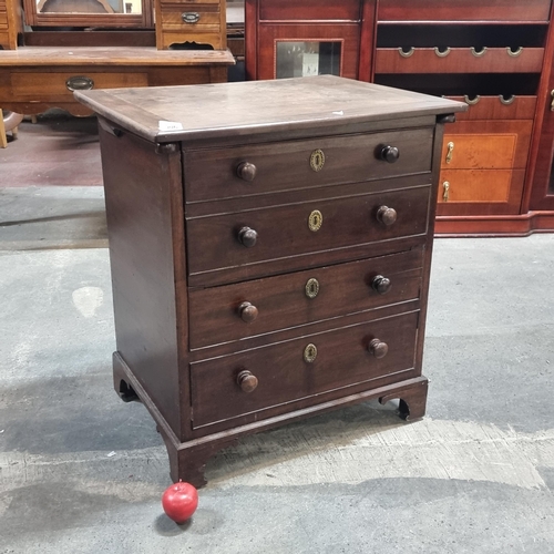 906 - A good looking unusual commode  in the form of an antique chest with four drawers with a false facad... 