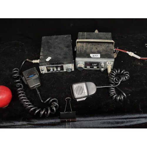 277 - Two vintage CB radios including a UNIDEN President AX 14 and a UNIDEN Sundowner UH001 example.