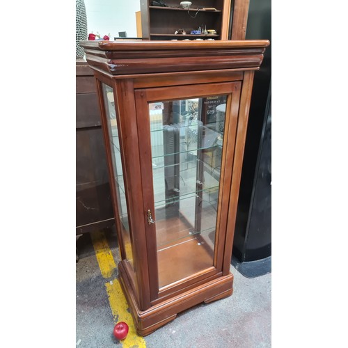 470 - Star Lot : A handsome display cabinet with three internal glass shelves. Featuring a mirrored back a... 