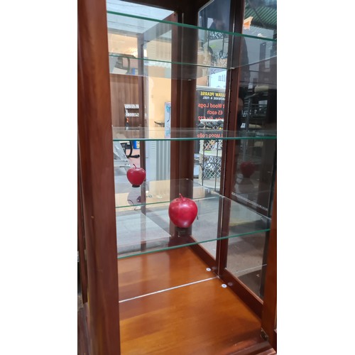 470 - Star Lot : A handsome display cabinet with three internal glass shelves. Featuring a mirrored back a... 