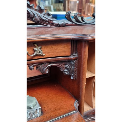 477 - Star lot : A magnificent example of an antique mahogany writing desk. This is an unusually ornate ex... 