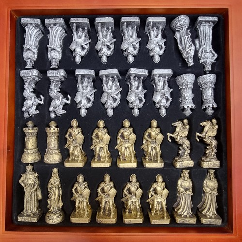 138 - A fabulous contemporary Chess set with a hieroglyphic inspired game board and a full set of thirty-t... 