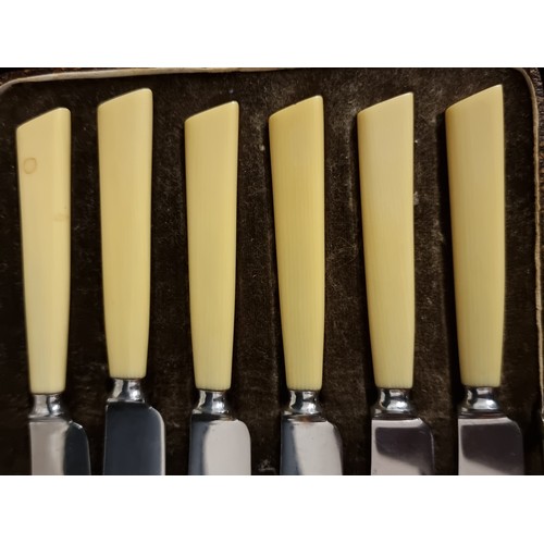 182 - Two vintage cutlery canteens including a set of six butter knives by 'Leppington Cuttlery Ltd'. With... 