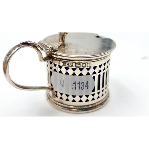 847 - A sterling Silver Mustard pot with a Bristol Blue glass liner. 68 grams, Assayed in London 1932