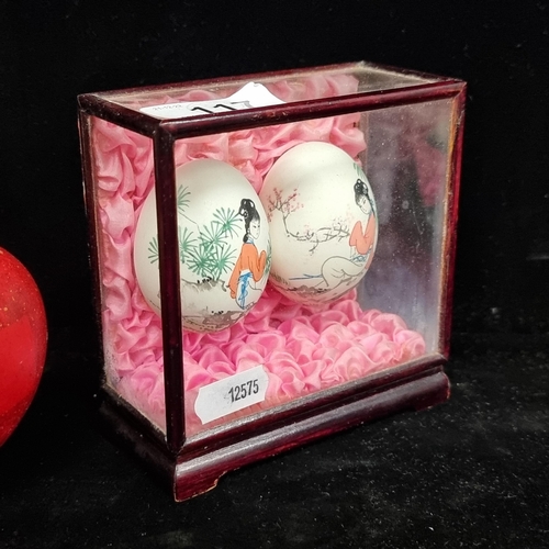 117 - A pair of beautiful vintage Japanese hand painted eggs, featuring portraits of elegant women in a ga... 