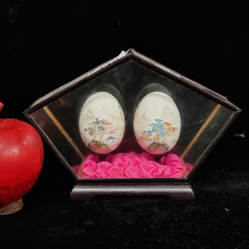 118 - A pair of beautiful vintage Japanese  hand painted eggs, featuring delicate landscape scenes. Housed... 