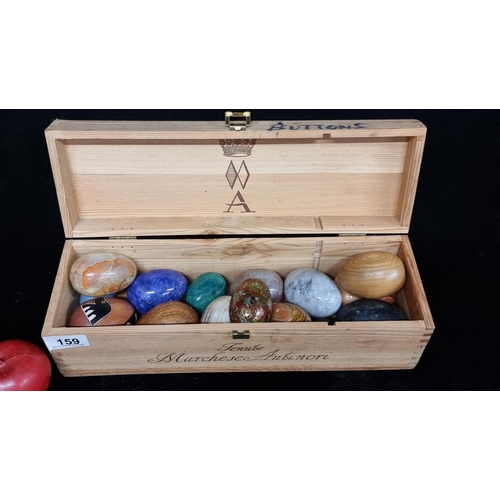 159 - A large collection of marble and crystal eggs including rose onyx, opalite, agat and solid wood exam... 