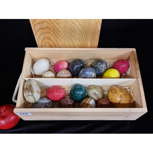 170 - A wooden wine box containing eighteen gemstone, onyx and marble eggs. Including rhodenite, green ony... 