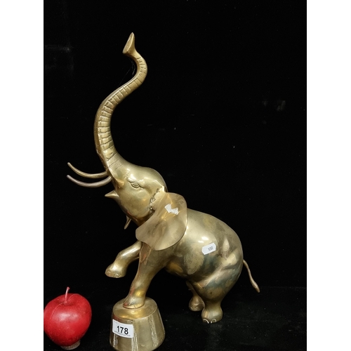 178 - A large brass sculpture of a performing circus elephant. H45cm