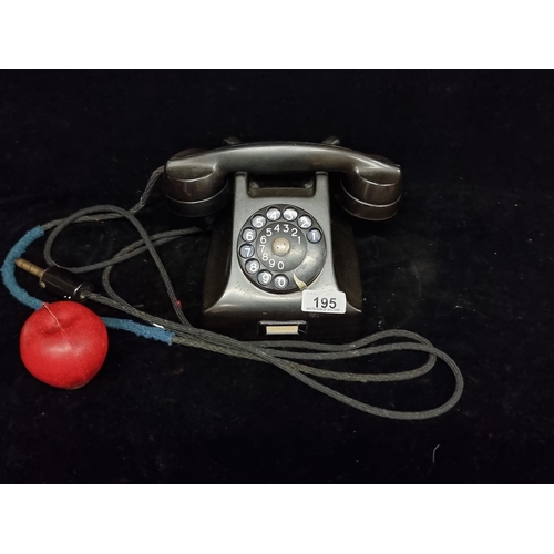 195 - A vintage rotary telephone made by Ericsson LM. Serial No: DBH 15X27 TP. Made in Sweden.