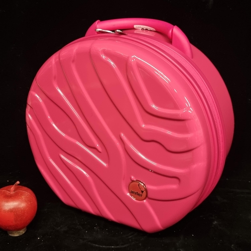 225 - A brand new, bright pink, cosmetics shell carry case by Antler in the Zahara series. With original t... 