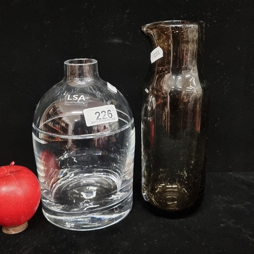 226 - Two contemporary glass items. Including an LSA International cut crystal bottle RRP £70 on company w... 