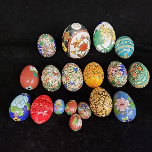 96 - A beautiful collection of seventeen ornamental eggs. Including lots of very ornate cloisonne example... 