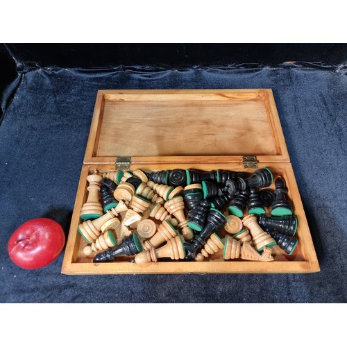 121 - A lovely portable wooden chess board with pieces for both chess and checkers held inside.