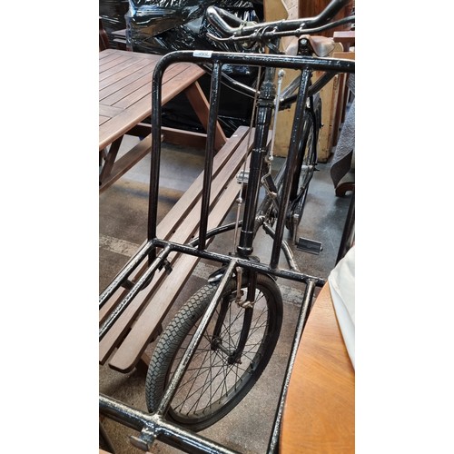 308 - Star lot : A super antique display bicycle with a prop-up frame for a basket, a bell and a leather B... 