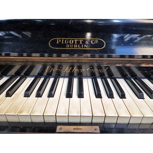 313 - Star Lot A fantastic black ebonised antique Pigott & Co. Dublin Upright Iron piano. With a beautiful... 