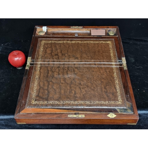 199 - Star Lot : A beautiful antique writing slope in a polished mahogany. Featuring a very handsome mottl... 