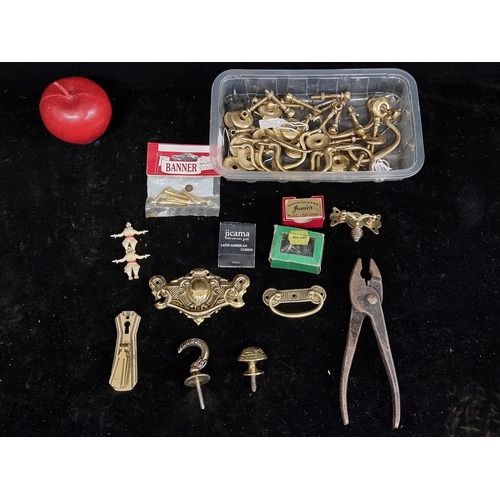 224 - A mixed lot, mostly consisting of elegant brass swan neck furniture handles and vintage DIY accessor... 