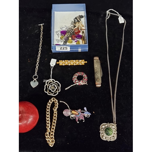 225 - A lovely collection of high quality costume jewelry, including clip on earrings, brooches, tie pins ... 