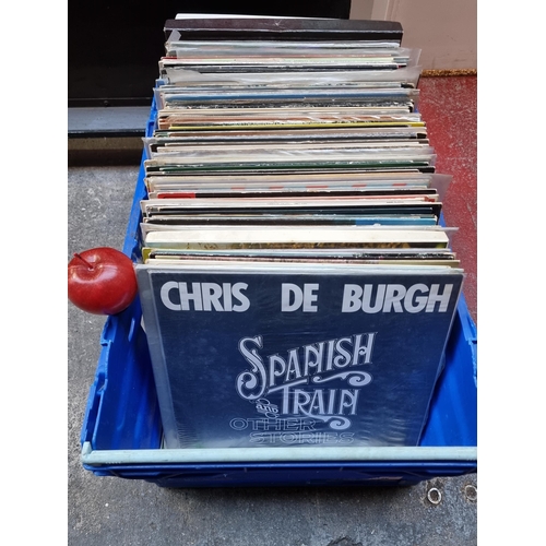 265 - A large selection of approximately 100 vinyl record LPs, including titles from artists Chris De Burg... 