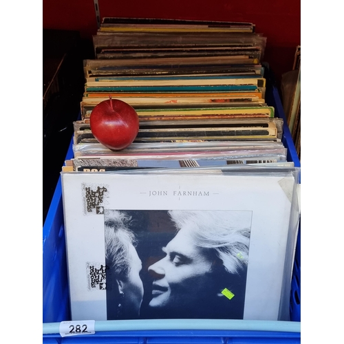 282 - A large selection of approximately 100 vinyl LPs, including albums by artists such as John Farnham, ... 