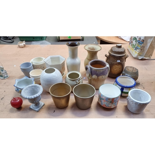 350 - A selection of twenty-three ceramic pots. Including a vintage West German rumtopf jar, a number of p... 