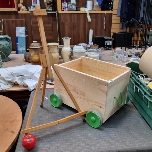 355 - A charming FLISAT pull cart. A wooden example with large rubber wheels. Supplied with a Lefranc and ... 