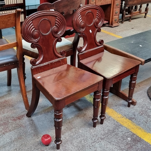 360 - Star lot : A fabulous pair of Victorian mahogany hall chairs ornate scroll detail and turned front l... 