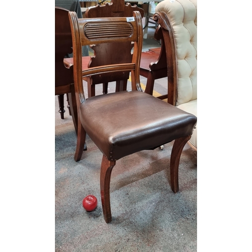 364 - A vintage occasional chair with curved backrest and brown leather upholstered seat. Featuring horizo... 