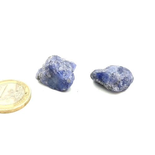 377 - A pair of rough-cut, natural tanzanite gemstone. Weight of 35.18 & 26.8  carats. Cold to the touch a... 