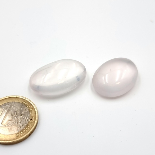 381 - A pair of fabulous oval cabochon cut, natural rose quartz gemstone. Weight of 32.25 and 26.1 carats.... 