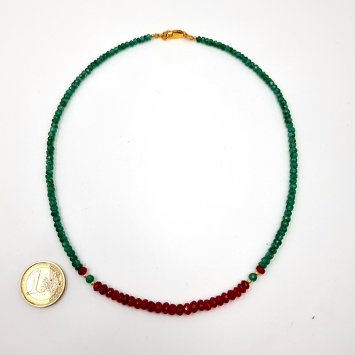 395 - A very pretty single row emerald and ruby necklace. Lovely colour match with green and red contrast ... 