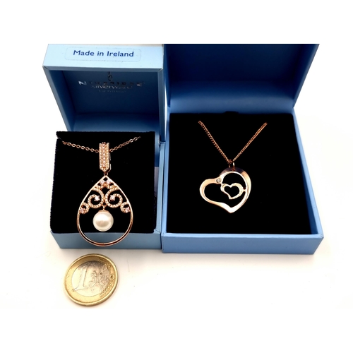 408 - Two very pretty Rose gold toned  Newbridge necklaces, a double heart gem set example together with a... 