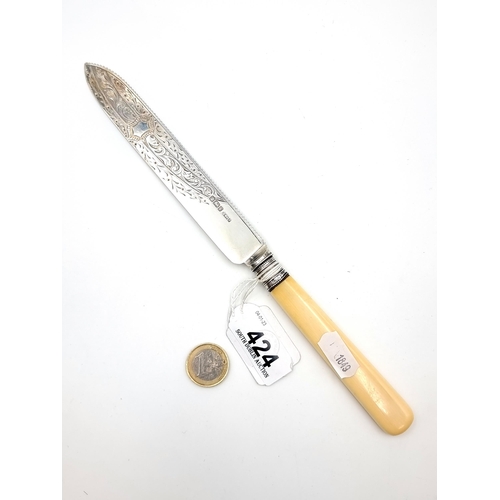 424 - A large  sterling silver bladed cake knife with attached bone handle hallmarked Sheffield, made by H... 