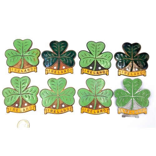 427 - A collection of 8 super vintage Irish shamrock insignia. car club metal screw mount badges 
Total we... 