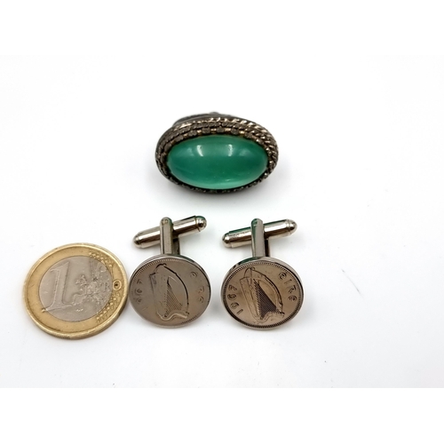 439 - An antique jade stone fob seal  with foliate surround mount together with a pair of Irish 1967 coin ... 