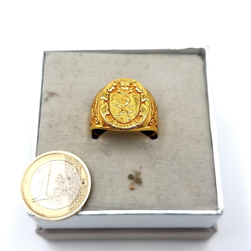 448 - A gold toned insignia Gents ring size U.
Weight: 13.23 grams With a lion and the word sweet. Its mar... 