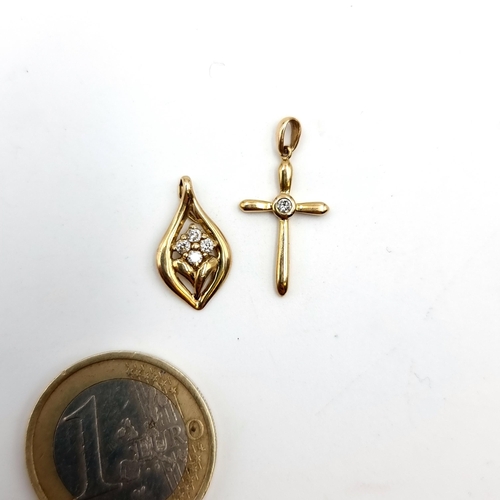 45 - Two 9 carat gold pendants both with diamond settings.  Total weight: 1.21 grams