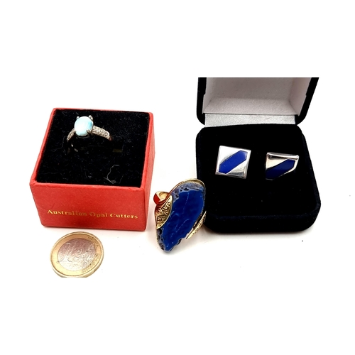 453 - A pair of silver and lapis lazuli stone cuff links, a large lapis lazuli stone ring size Q (weight: ... 