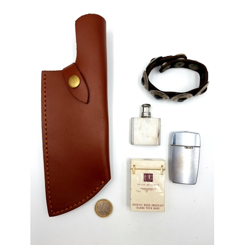 455 - Five items consisting of a leather cleaver style knife cover, together with a metal disc bracelet, a... 