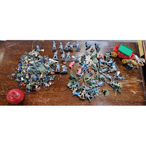 475 - A large selection of collectible toys including toy soldiers and other figures.